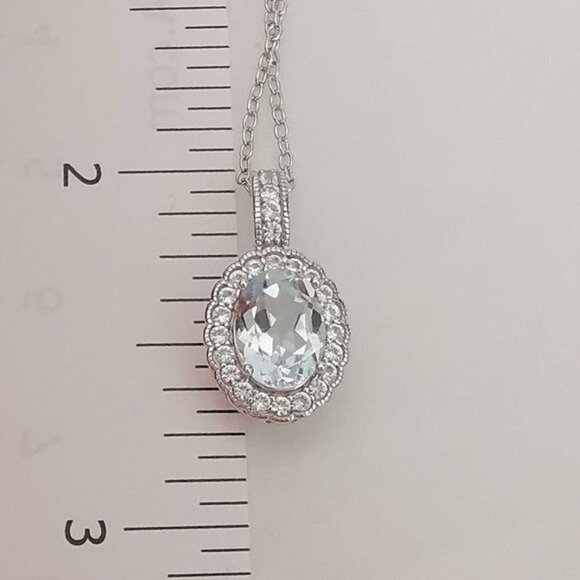 Diamond halo around Sky Blue Topaz pendant necklace - Picture 6 of 9